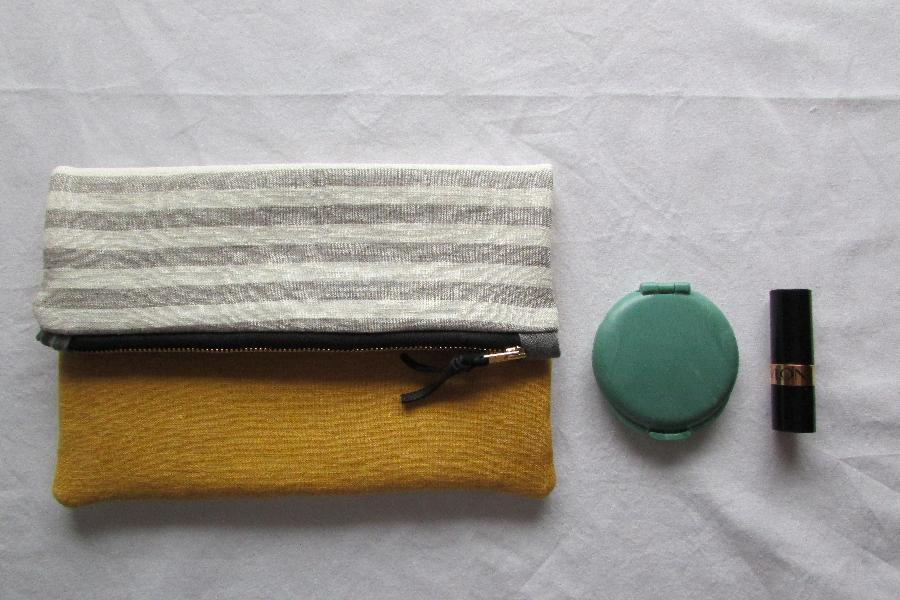 Marie, 100% Linen Fold-Over-Clutch. Made with yellow linen on the front, gray striped linen on the back, an...