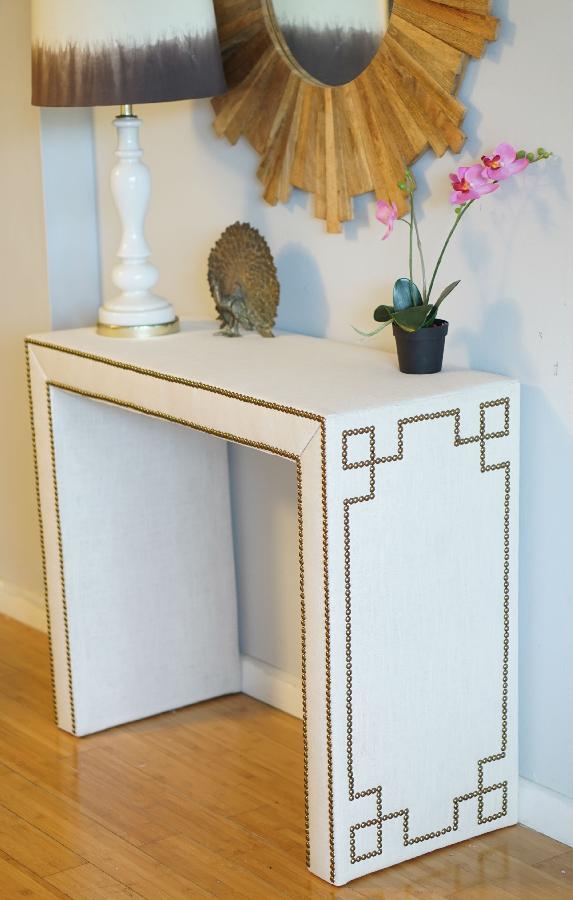 Alexis, Custom made console table wrapped in linen with nail heads in a Greek Key design!