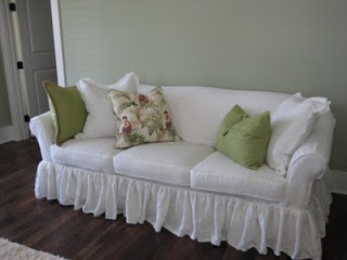 Debbie, Ruffled bleached white washed linen sofa slipcover with ruffled skirt and self cording detail.  Sepa...