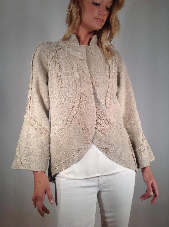 Peter, Linen jacket with free form appliqués.The applied
design is cut on bias by stitching with a sewing...