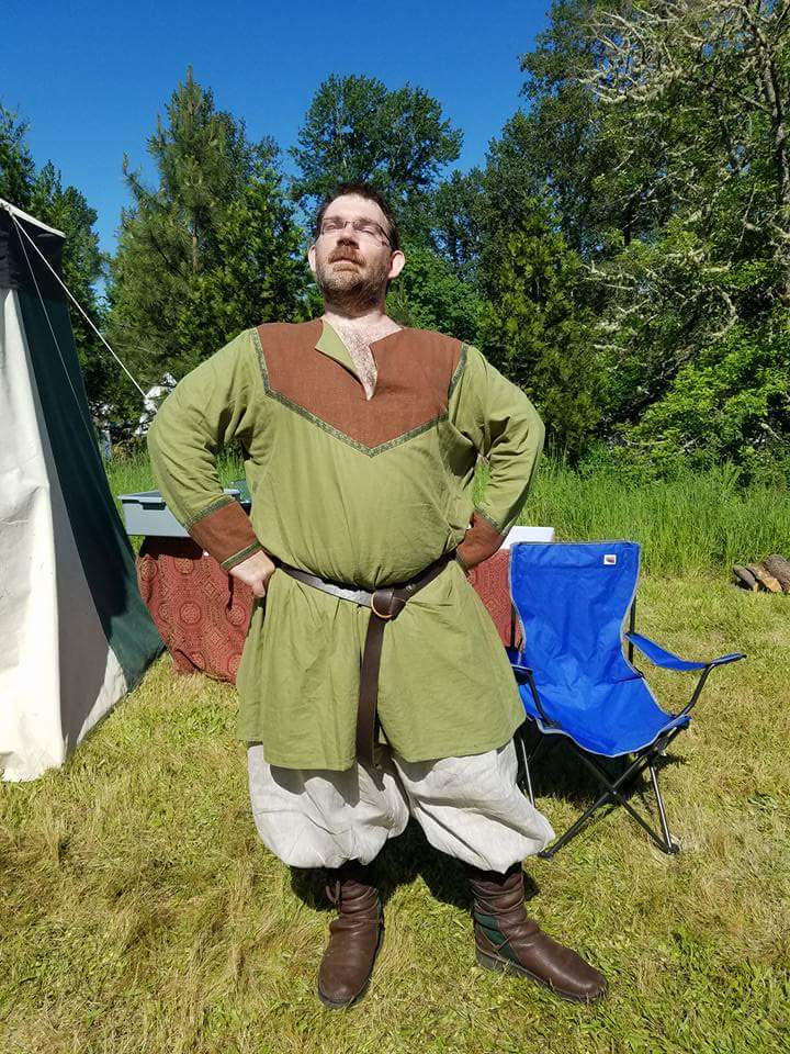 James, Green and Brown Tunic with natural pants.