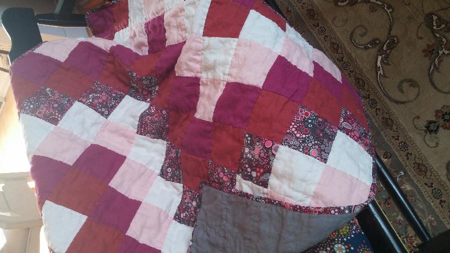 Anne, Baby girl quilt with cotton accent. Hand quilted for a nice pockered look.