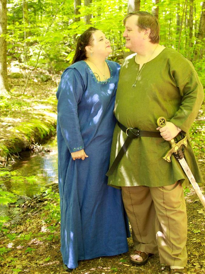 Kristina, Viking womens kirtle and mens tunic and trousers.  The kirtle is decorated with hand embroidered d...