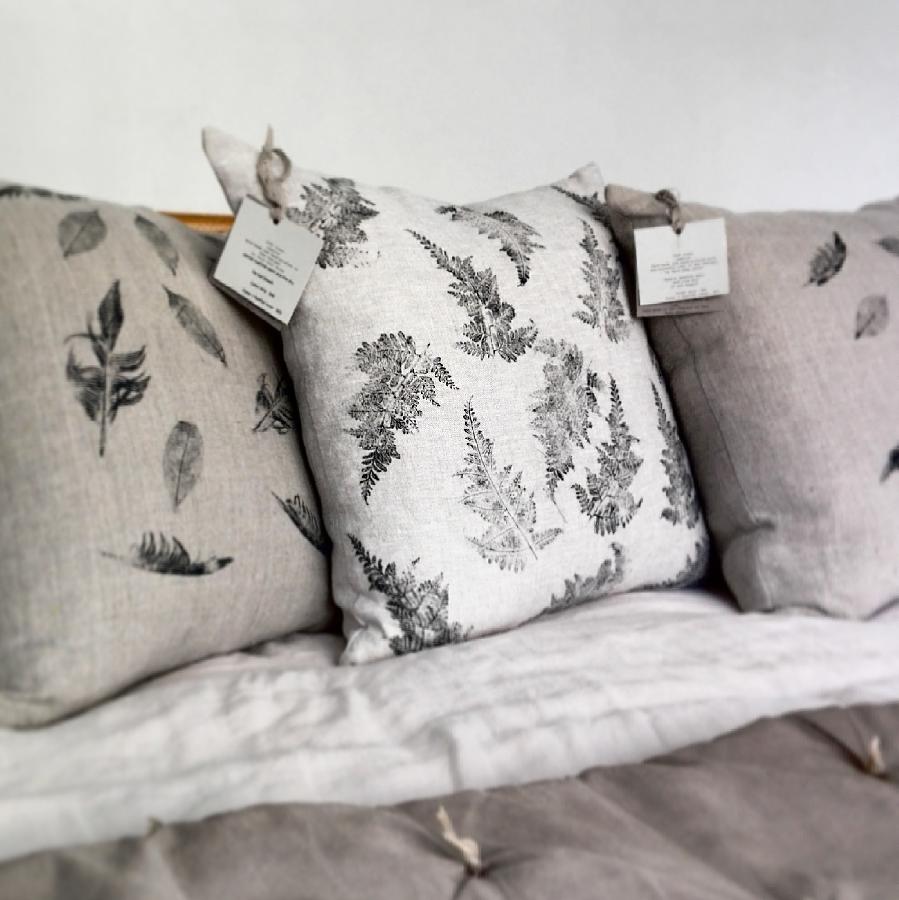 Angela, A mixture of heavyweight natural and mix natural linen cushions. Hand printed with leaves and feathe...
