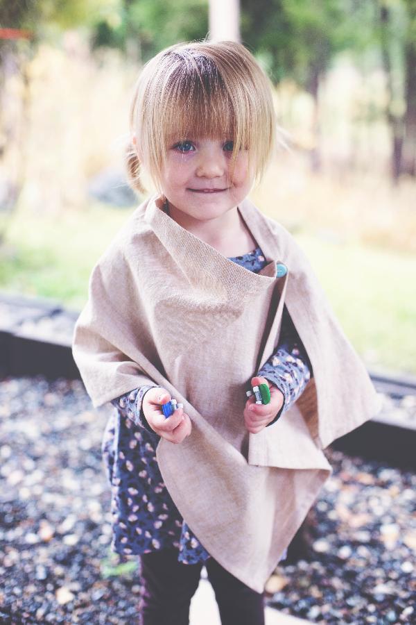 Andrea, Simple, yet stylish, this lovely linen poncho for little girls, leaves those little hands free to do...
