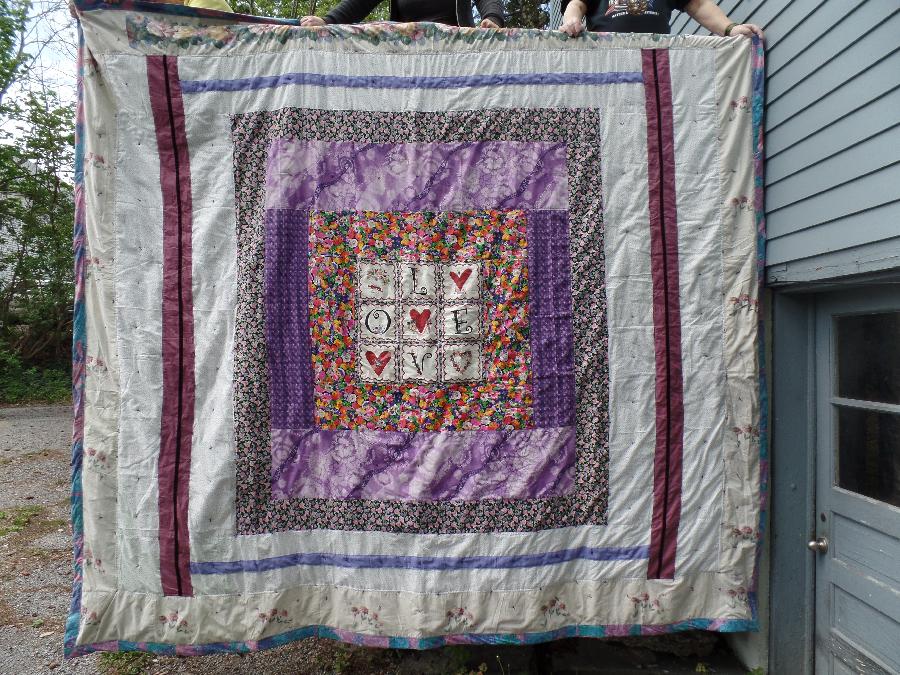 Doris, the  front of a king size quilt I made in 2016  all out of used material items bought at use store o...