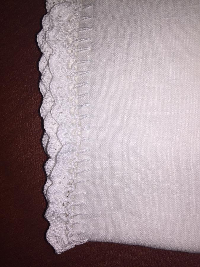 Claudia, Linen pillowcases with hand crocheted lace edges.  These were a wedding gift for my cousin. 