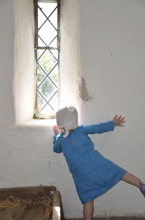 Tracy, Peeking out the window of an old castle in Ireland, this little lass is wearing a blue linen tunic o...
