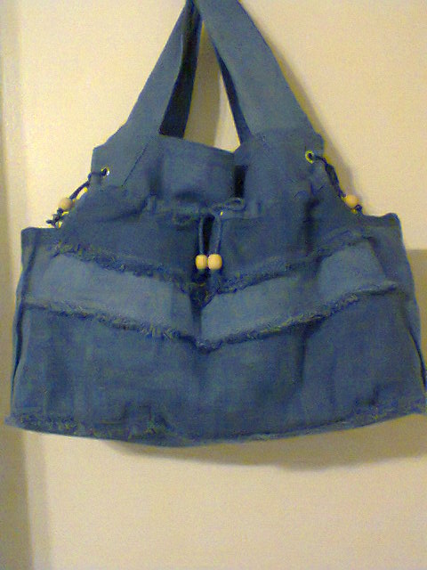 Lona , various wts of bleached dyed with indigo dye created a baby bag for my daughter