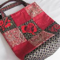 Fashion glamour tote. Brocade, shimmer, and quilted fabrics, fully lined, embellished with custo...