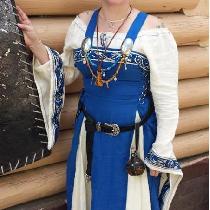 This is a commissioned Viking wedding dress. The apron dress is made with royal blue panels and...