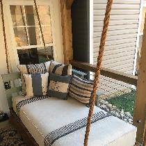 Debra , My swinging porch bed adorned with a com...