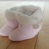 Cozy pink baby booties with Velcro closure