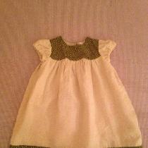 A cute, scalloped baby dress, made in medium weight linen, and lined in light weight linen, with...