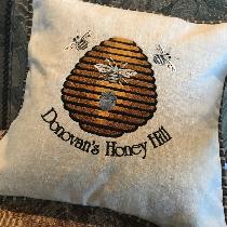 Custom Embroidered 16” square pillow depicting Honeybee Farm. The design is embroidered on mediu...