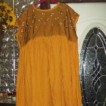Shift dress in autumn gold lightweight linen with a bee mesh overlay