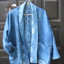 This is a lightweight 5.3 oz linen.  I scoured it.  Stitched it with Shibori designs and indigo...