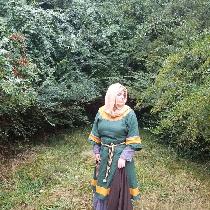 A reproduction of an 11th century Anglo-Saxon woman. Made of emerald green linen with gold trim,...
