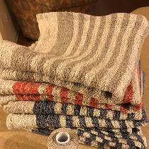 Hand towels approximately 28" x 18" hand towels. Various colors and patterns.