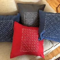 Four Sashiko embroidered pillow cases.
