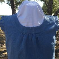 A detail shot of my linen blouse, showing the gathered neckline and ruffled sleeve caps.