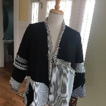 This is a one of a kind self drafted jacket pattern, base is black linen with bits of scraps use...