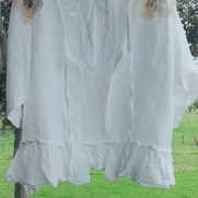 A light cover up in bleached linen.
I've decorated this with vintage doilys at the neckline, a t...
