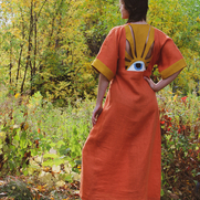The Eye Gown is made of IL019 MECCA ORANGE Softened Linen and IL019 Sand Linen. The eye detail i...