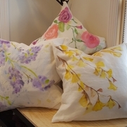 Eileen , These pillow covers are had painted on b...