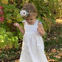This is my little June bug and thinks twirling in her linen dress is very special