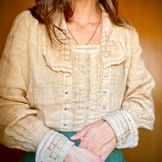 This blouse is 1920s inspired. It includes drawn thread work on the cuffs and collar, as well as...