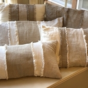 Working with a variety of weights, using bleached and natural colors, to create pillow covers. T...