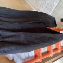 Black linen slip on pants with side pockets. Goes with everything and travels well too!
