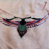 Light weight pink linen shift with embroidered scarab.