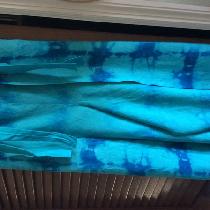 Shibori dyed wrap pants.  Linen was first dyed with turquoise and then over dyed with indigo....