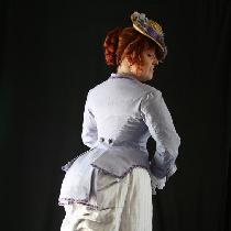 An 1880s day wear bustle gown