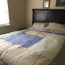 Linen sheets, pillowcases, and coverlet
