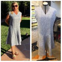 All linen unlined but finished seams. Drop waisted dress with arm and neck facings. Invisible zi...