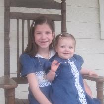 These are matching Easter dresses in Bluebonnet for my two daughters.  The older daughter's dres...