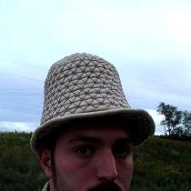 A handsewn armored hat made in linen canvas and lined in more linen with over 300 steel plates s...
