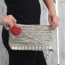 Devon, A strapped clutch made from two medium w...