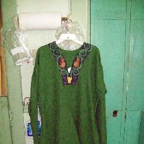 This is my idea of a 12th century Northern German tunic.  It is entirely handsewn in green and p...
