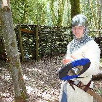 A knight inspecting his blade.