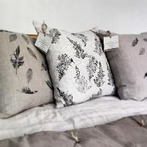 A mixture of heavyweight natural and mix natural linen cushions. Hand printed with leaves and fe...