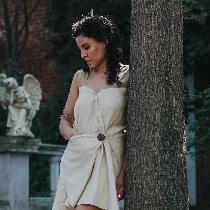 100% linen Roman Draped Mini Dress, featuring a folded asymmetrical front seam and hidden triang...