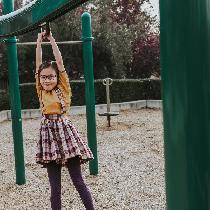 Czarina, Mustard linen top and a plaid suspender...