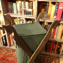 Viking Laundry Basket realized in medium weight green linen.  Dragon supports are adapted from t...