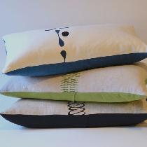 Zoe, Hand silk-screened pillows made from med...